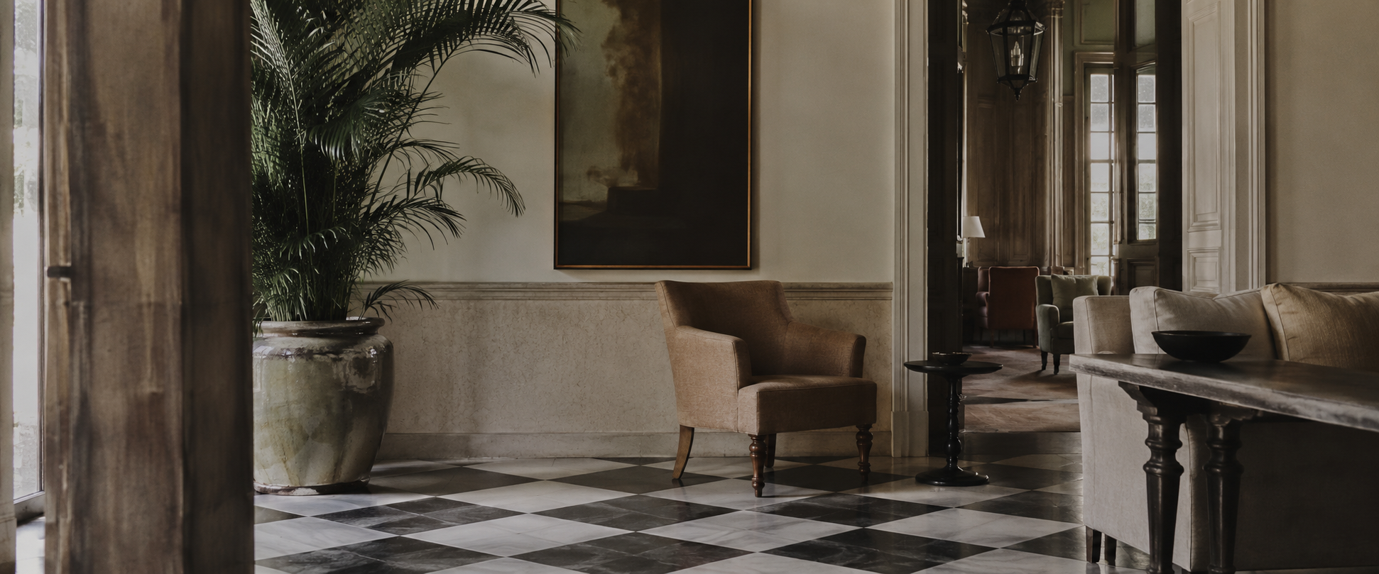 Hotel lobby with checkered marble floors — hotel commercial strategy and revenue management